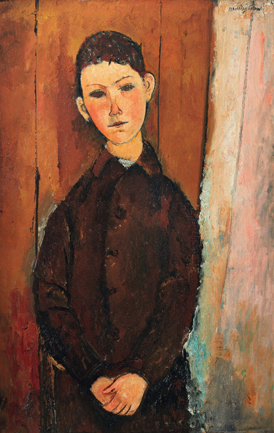 boy with hands crossed in lap