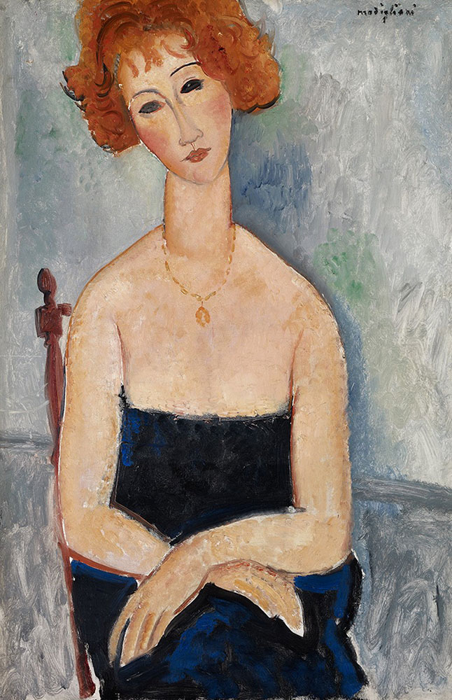red haired woman with pendant